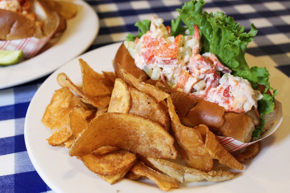 a shrimp sandwich with fries